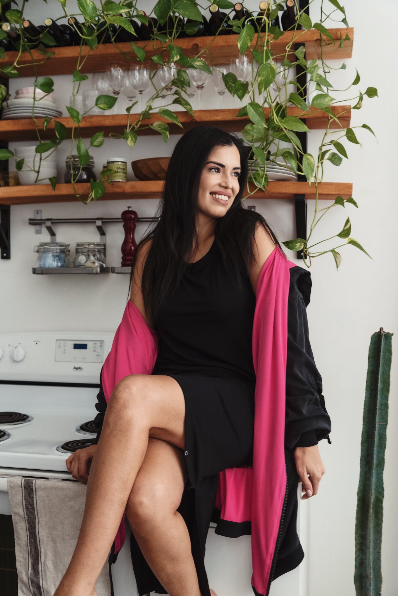 A woman sits in a chair wearing a timeless outfit styled by Toronto-based clothing stylist Cassandra Elizabeth, highlighting a quiet luxury brand, personalized style, and a minimal wardrobe created through expert styling clothing services.

